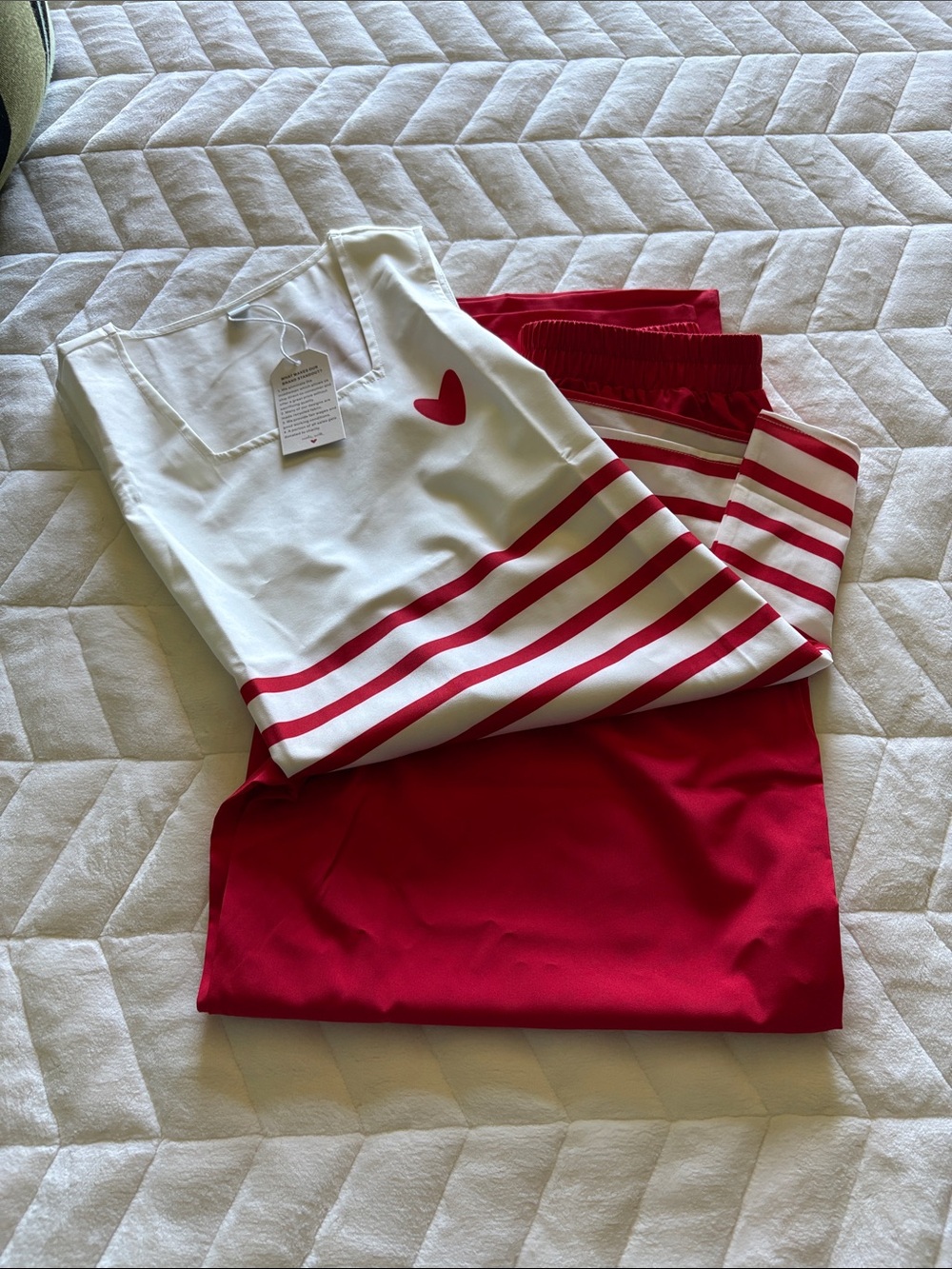 Women’s Sleeveless White & Red Striped Tank Top with Heart Detail and slacks